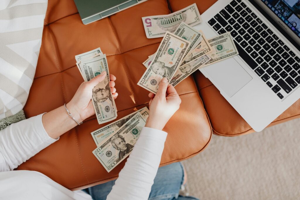 person using laptop to earn money online from home