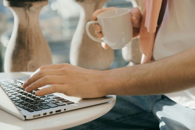 person working from home on laptop earning money online